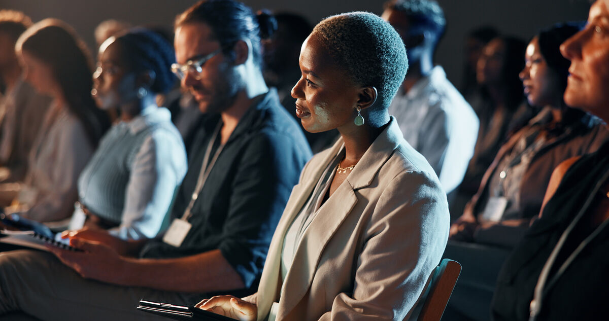 Listening night and business woman at conference for tech seminar